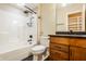 Bright bathroom featuring a shower/tub combination and a granite topped vanity with wooden drawers at 2377 Finchley Rd, Carmel, IN 46032