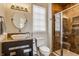Bathroom with decorative tile shower and granite countertops and plenty of natural light from the large window at 2377 Finchley Rd, Carmel, IN 46032