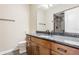Bathroom with granite countertop vanity, wood cabinets, and shower with glass door at 2377 Finchley Rd, Carmel, IN 46032