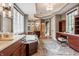 Spa-like bathroom with double sink vanity, soaking tub, and a large window offering plenty of natural light at 2377 Finchley Rd, Carmel, IN 46032