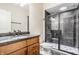 Stylish bathroom with dark tiled shower, glass enclosure, and a modern granite vanity at 2377 Finchley Rd, Carmel, IN 46032