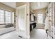 Well-designed walk-in closet featuring custom shelving, full-length mirror, and a window bench with storage at 2377 Finchley Rd, Carmel, IN 46032