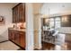 Dining room with a serving station, view of archways to the dining room, and stylish wood flooring at 2377 Finchley Rd, Carmel, IN 46032