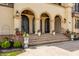 Stunning entryway with arched doorways and manicured landscaping at 2377 Finchley Rd, Carmel, IN 46032