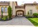 Beautiful home with an arched gate leading to a driveway and a meticulously kept lawn at 2377 Finchley Rd, Carmel, IN 46032