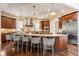 Beautiful kitchen featuring a large island with seating, custom cabinetry, and stainless steel appliances at 2377 Finchley Rd, Carmel, IN 46032
