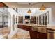 Spacious kitchen with large island, farm sink, and open view to the living room at 2377 Finchley Rd, Carmel, IN 46032