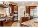 Modern kitchen with stainless steel appliances, a gas cooktop, and granite countertops at 2377 Finchley Rd, Carmel, IN 46032