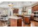 Well-appointed kitchen with large island, stainless appliances and wood floors at 2377 Finchley Rd, Carmel, IN 46032