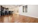 Open-concept living space featuring hardwood floors and views of a modern kitchen at 2377 Finchley Rd, Carmel, IN 46032
