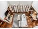 Birds eye view of a living room with fireplace, large windows, and an open floor plan at 2377 Finchley Rd, Carmel, IN 46032