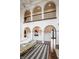 Elegant living room featuring high ceilings, arched doorways, and a cozy seating area at 2377 Finchley Rd, Carmel, IN 46032