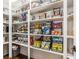 Walk-in pantry with custom shelving and storage for ample food and kitchen supplies at 2377 Finchley Rd, Carmel, IN 46032