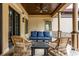 Covered patio featuring wicker chairs and a plush sofa, a perfect outdoor oasis at 2377 Finchley Rd, Carmel, IN 46032