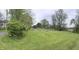 A spacious backyard features a fenced-in enclosure and plenty of greenery, perfect for outdoor enjoyment at 255 S 900 E, Zionsville, IN 46077