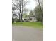 Charming two-story home with brown shutters and a well-maintained lawn and mature trees at 255 S 900 E, Zionsville, IN 46077