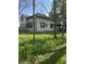 Charming home featuring green lawn, dark shutters, and mature trees at 255 S 900 E, Zionsville, IN 46077