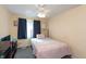 Cozy bedroom with carpet floors, neutral walls, ceiling fan, and natural light at 3131 Stillmeadow Dr, Indianapolis, IN 46214