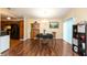 Dining room featuring laminate floors, neutral walls, with decorative light fixture at 3131 Stillmeadow Dr, Indianapolis, IN 46214