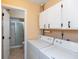 Laundry area features a washer, dryer and built-in white cabinets at 3131 Stillmeadow Dr, Indianapolis, IN 46214