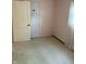 Bedroom featuring carpet, painted walls, window, and closet door at 318 Elva St, Anderson, IN 46013