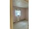 Bedroom featuring neutral carpet, window with sheer curtains, and pink walls at 318 Elva St, Anderson, IN 46013
