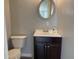 Bathroom featuring a toilet, vanity, and mirror offering functionality in a neutral color palette at 3720 E Southern Ave, Indianapolis, IN 46203