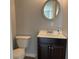 Bathroom featuring a toilet, vanity, and mirror offering functionality in a neutral color palette at 3720 E Southern Ave, Indianapolis, IN 46203