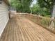 Outdoor wooden deck with railings overlooks lush green yard and mature trees, perfect for outdoor relaxing at 3720 E Southern Ave, Indianapolis, IN 46203