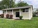Charming two-story home with landscaped front yard, and inviting entryway with large columns at 3720 E Southern Ave, Indianapolis, IN 46203