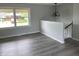 An empty living room with gray walls and a large window for natural light to enter the room at 3720 E Southern Ave, Indianapolis, IN 46203