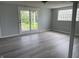 Room featuring glass block window and vinyl floors and a door leading to the yard at 3720 E Southern Ave, Indianapolis, IN 46203