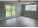 Room featuring glass block window and vinyl floors and a door leading to the yard at 3720 E Southern Ave, Indianapolis, IN 46203