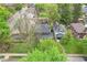 An aerial view of a beautiful home featuring a well-maintained backyard and mature trees in a quiet neighborhood at 4169 Central Ave, Indianapolis, IN 46205