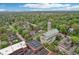Picturesque aerial view highlighting the neighborhood's church and tree-lined streets, adding to the area's charm and community feel at 4169 Central Ave, Indianapolis, IN 46205