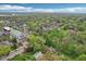Scenic aerial view of a neighborhood featuring mature trees and a prominent church, creating a picturesque and peaceful setting at 4169 Central Ave, Indianapolis, IN 46205