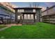 Spacious backyard with lush green lawn, patio area, and privacy fencing, perfect for outdoor entertaining at 4169 Central Ave, Indianapolis, IN 46205