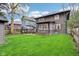 Lush backyard with green grass, mature trees, and outdoor seating area; great for entertaining at 4169 Central Ave, Indianapolis, IN 46205