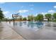 Outdoor basketball court with hoops and surrounding greenery under a bright sky with light cloud cover at 4169 Central Ave, Indianapolis, IN 46205