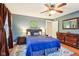 Comfortable bedroom featuring a plush bed, hardwood floors, and natural lighting at 4169 Central Ave, Indianapolis, IN 46205
