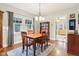 Cozy dining room with wood table and chairs, plus a glimpse into an adjacent space at 4169 Central Ave, Indianapolis, IN 46205