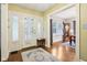 Bright entryway featuring hardwood floors, a beautiful rug, and ample natural light at 4169 Central Ave, Indianapolis, IN 46205
