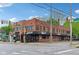 Corner lot exterior featuring a two-story brick building with street signage and awning covered entrances at 4169 Central Ave, Indianapolis, IN 46205