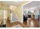 Inviting foyer with stairs leading to the upper level and access to the living room at 4169 Central Ave, Indianapolis, IN 46205