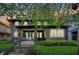 Charming home featuring a covered front porch with a swing and a bright blue front door at 4169 Central Ave, Indianapolis, IN 46205