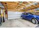 Spacious two-car garage with ample lighting and storage space, plus a car parked inside at 4169 Central Ave, Indianapolis, IN 46205