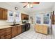 Bright kitchen featuring wood cabinets and a black appliance package at 4169 Central Ave, Indianapolis, IN 46205