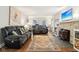 Inviting living room featuring hardwood floors, stone fireplace, and comfortable seating at 4169 Central Ave, Indianapolis, IN 46205
