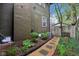 Landscaped side yard featuring stepping stones, mature plants, and a clean, well-maintained pathway at 4169 Central Ave, Indianapolis, IN 46205