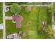 Birds eye view of single Gathering home with a large manicured lawn, garden, shed, and long driveway at 417 W Ash St, Jamestown, IN 46147